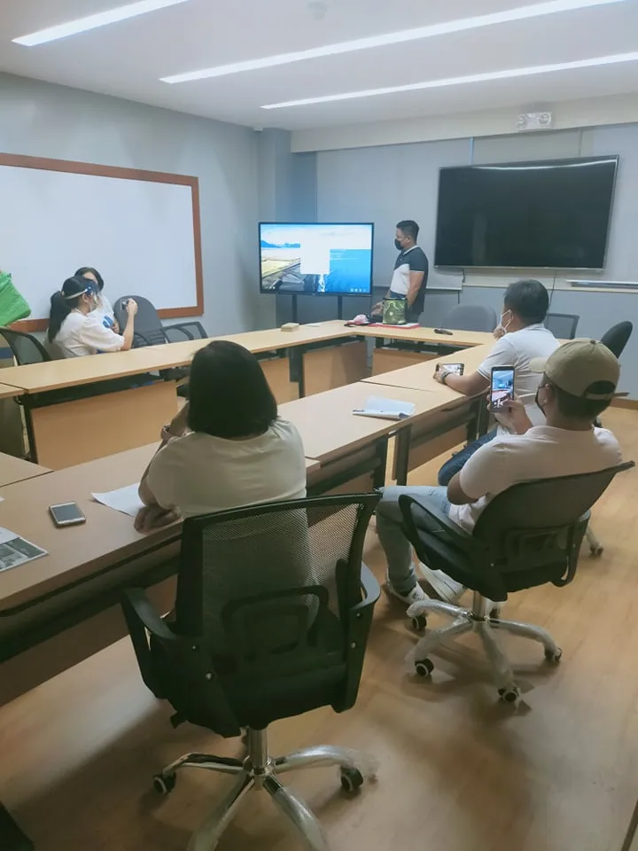 Presentation on a large-format display in an agency conference room