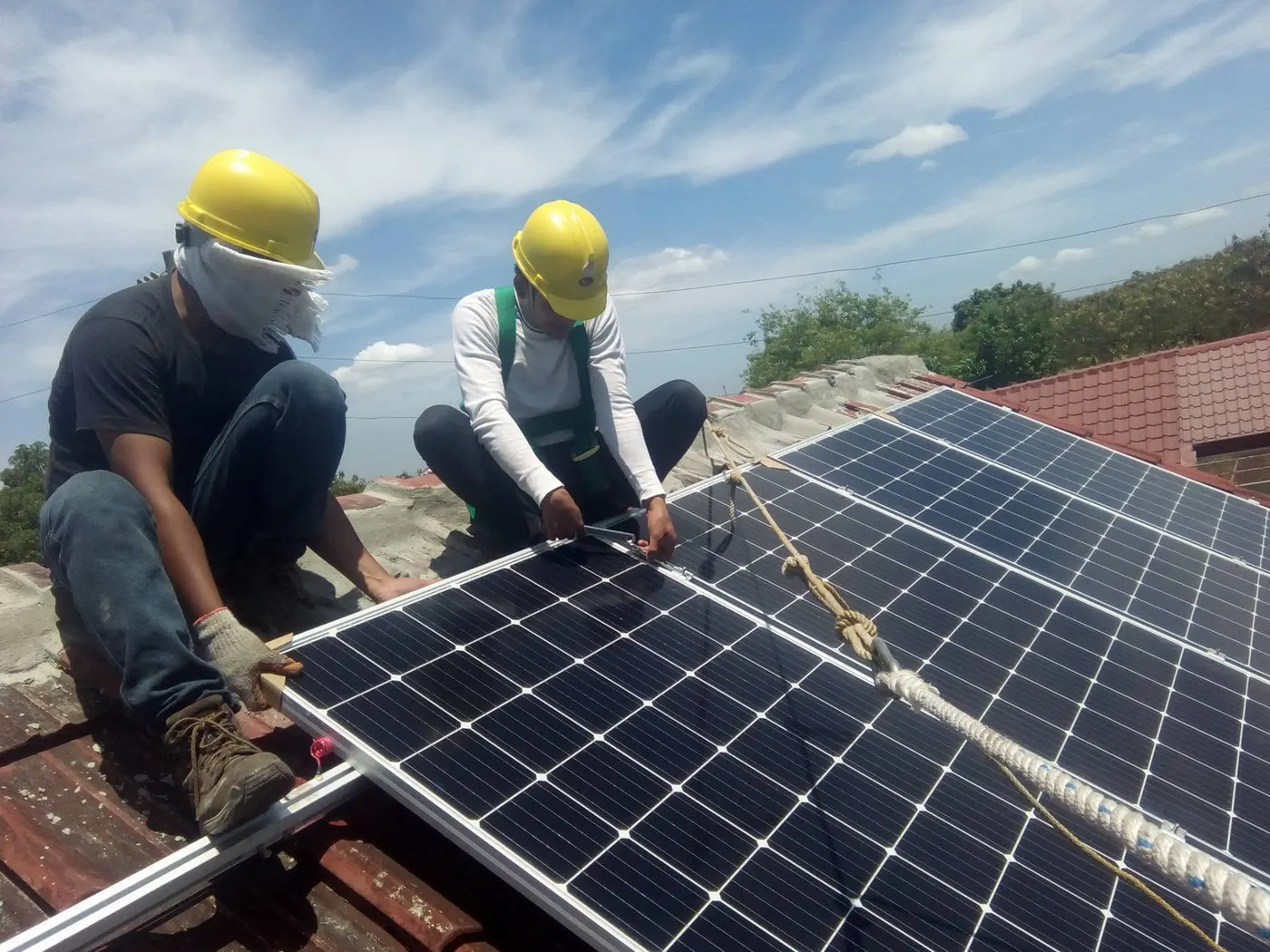 Wattsavers crew installing solar panels on a rooftop